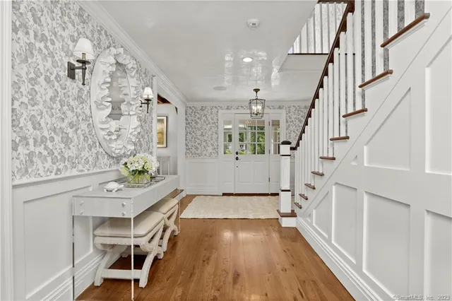 a view of a livingroom with furniture and stairs