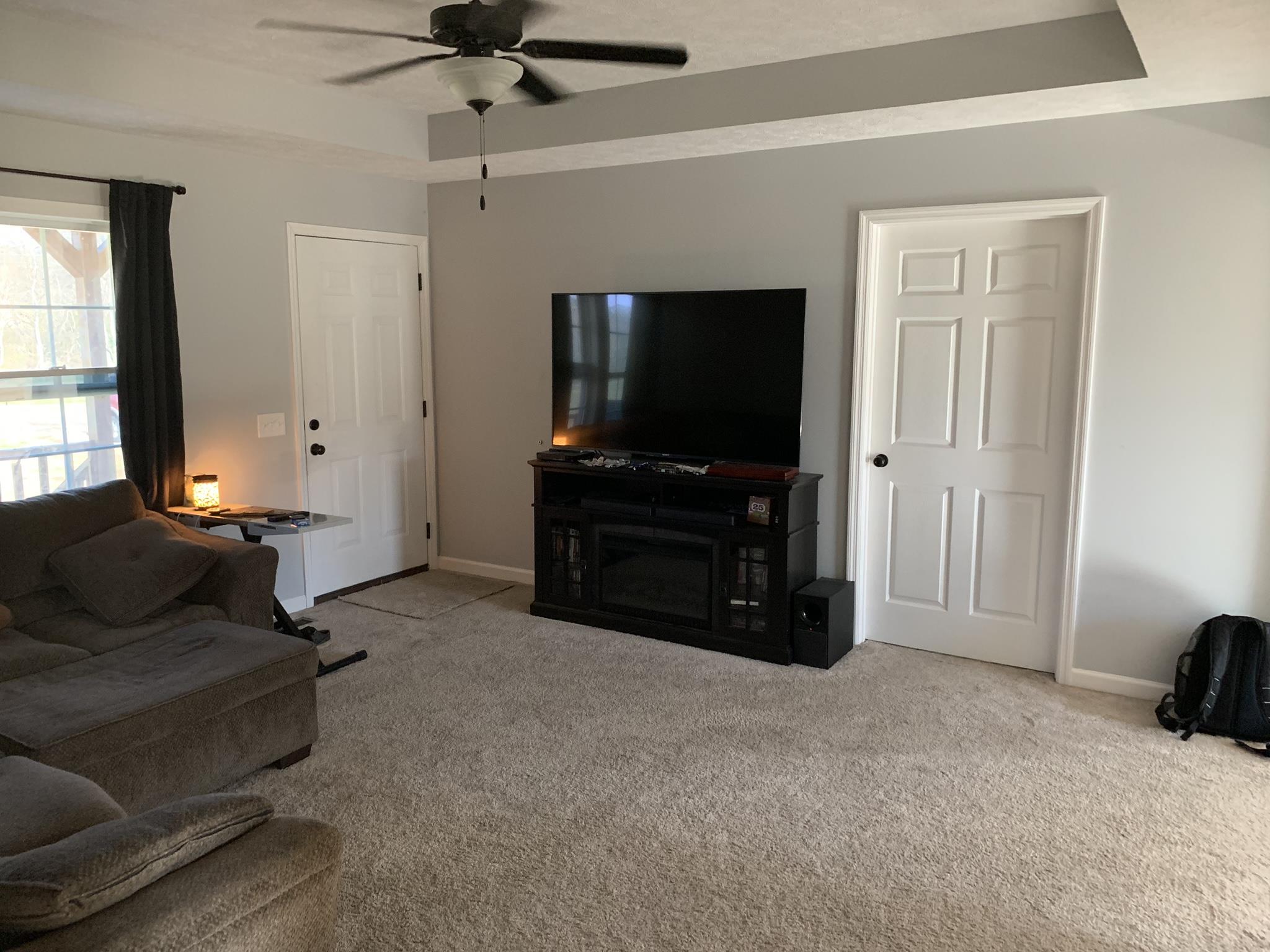 311 Goose Creek Road Alexandria, TN 37012 - Photo 5 of 22 Living room with beautiful trayed ceiling and ceiling fan