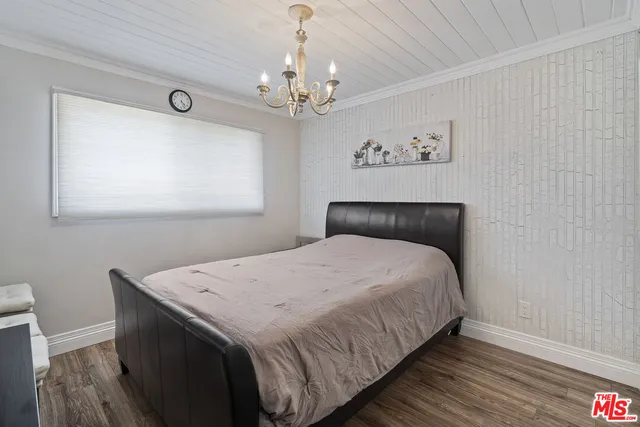 a bedroom with bed and window