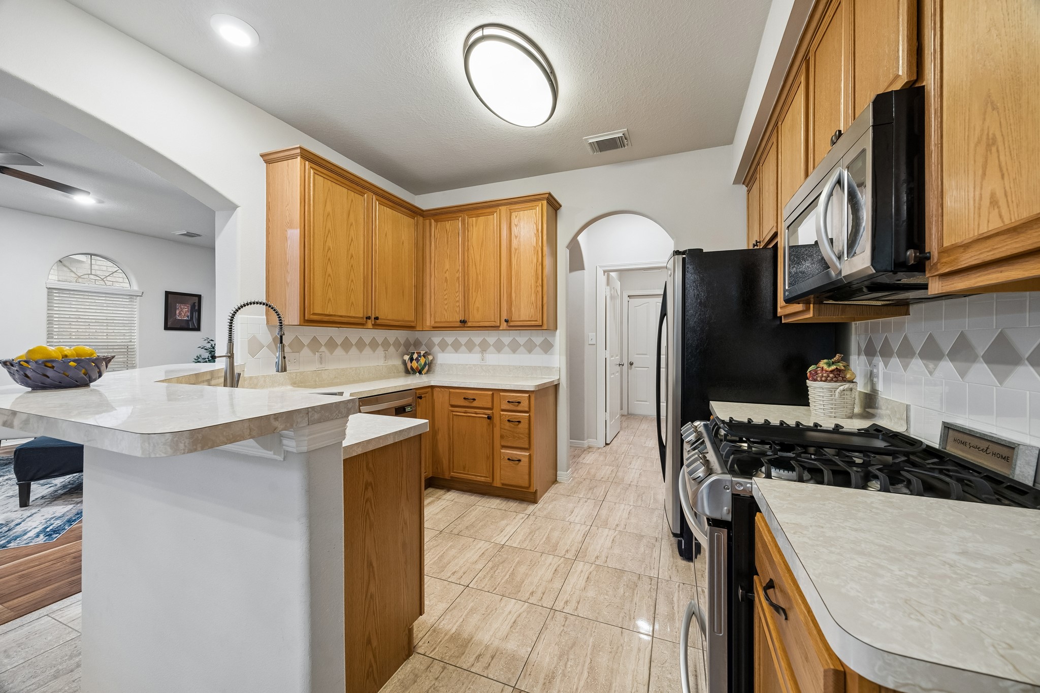 7618 North Linpar Court Houston, TX 77040 - Photo 6 of 34 The Kitchen has lots of storage space and opens to the living room.