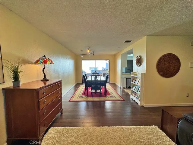 a kitchen with stainless steel appliances a sink dishwasher stove refrigerator and cabinets