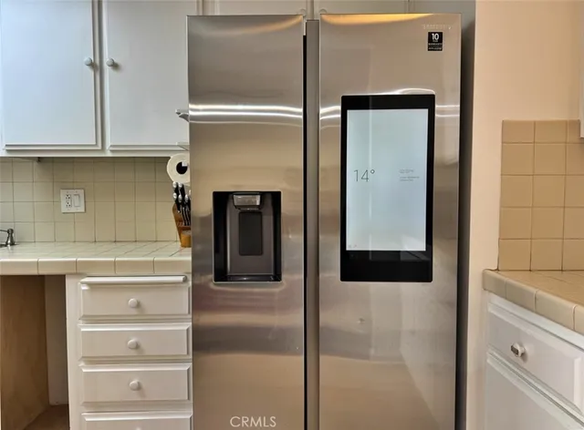 a kitchen with cabinets appliances and a sink