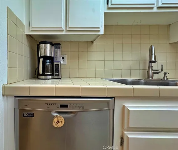 a kitchen with a stove and a sink