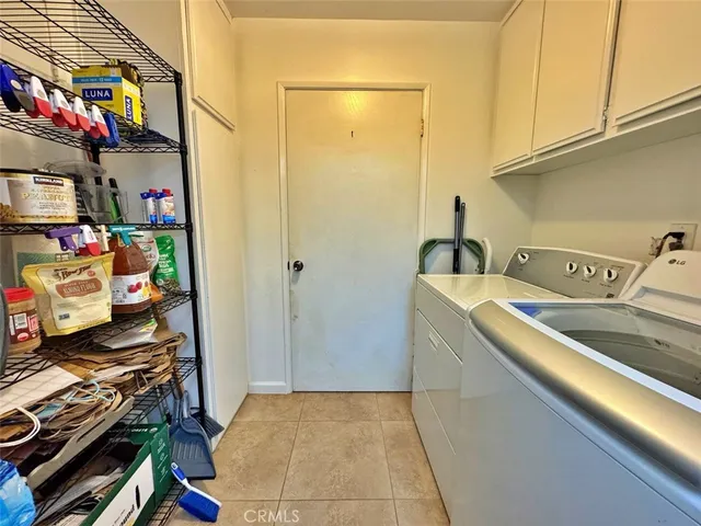 a kitchen with a refrigerator and a stove top oven