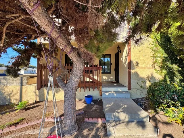 a view of a chairs and table in the patio