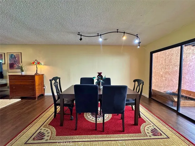 a reading room with furniture and wooden floor