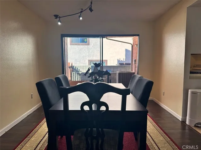 a bedroom with a bed window and a mirror