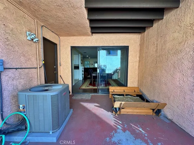 a view of livingroom with wooden floor and flat screen tv