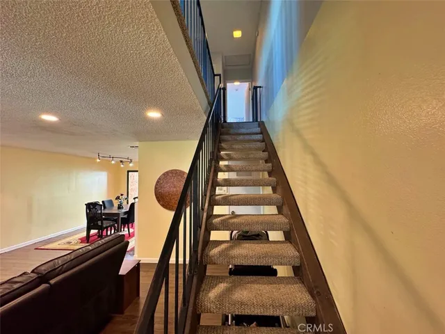 a bathroom with a double vanity sink mirror and toilet