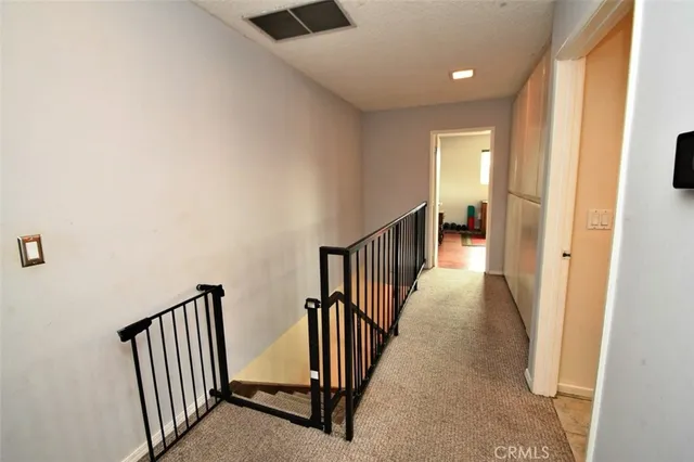 a bathroom with a granite countertop shower a toilet and a sink