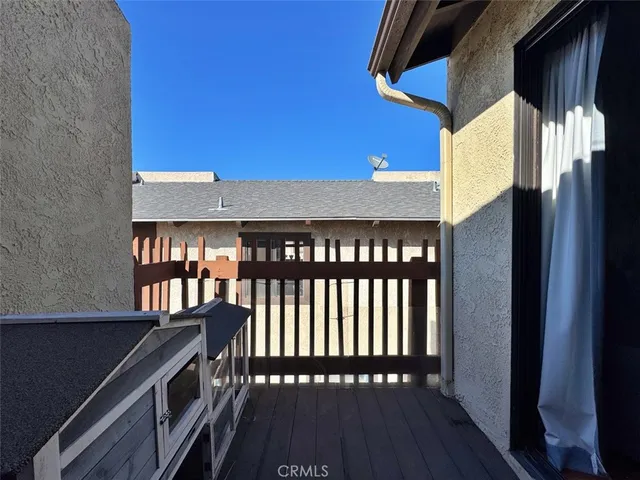 an aerial view of a house with a yard and lake view
