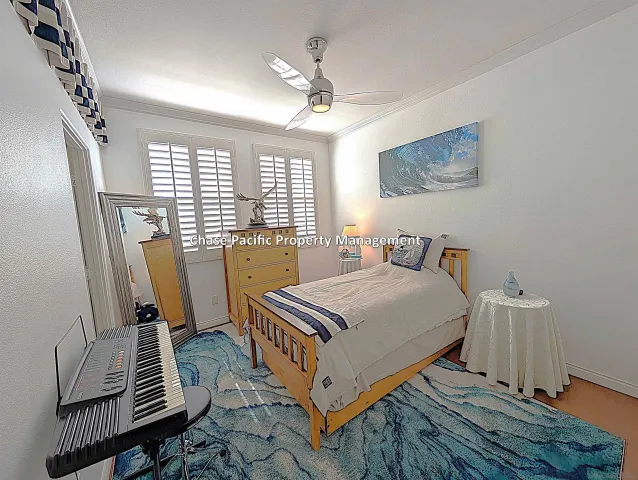 a bedroom with furniture and a window