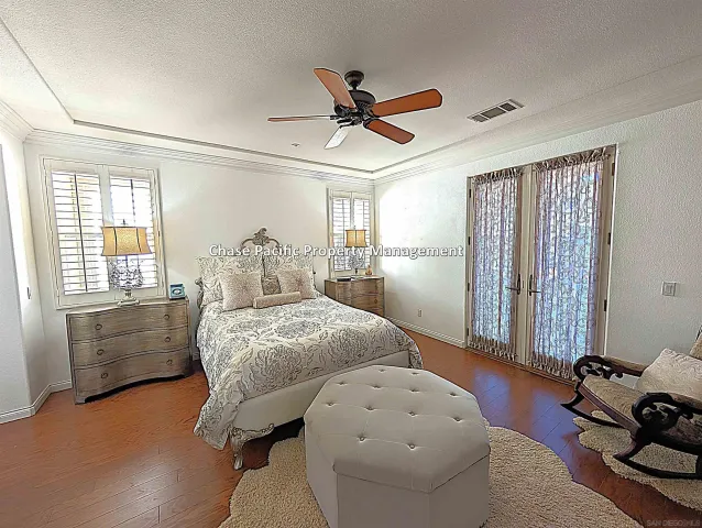 a bedroom with furniture and a window