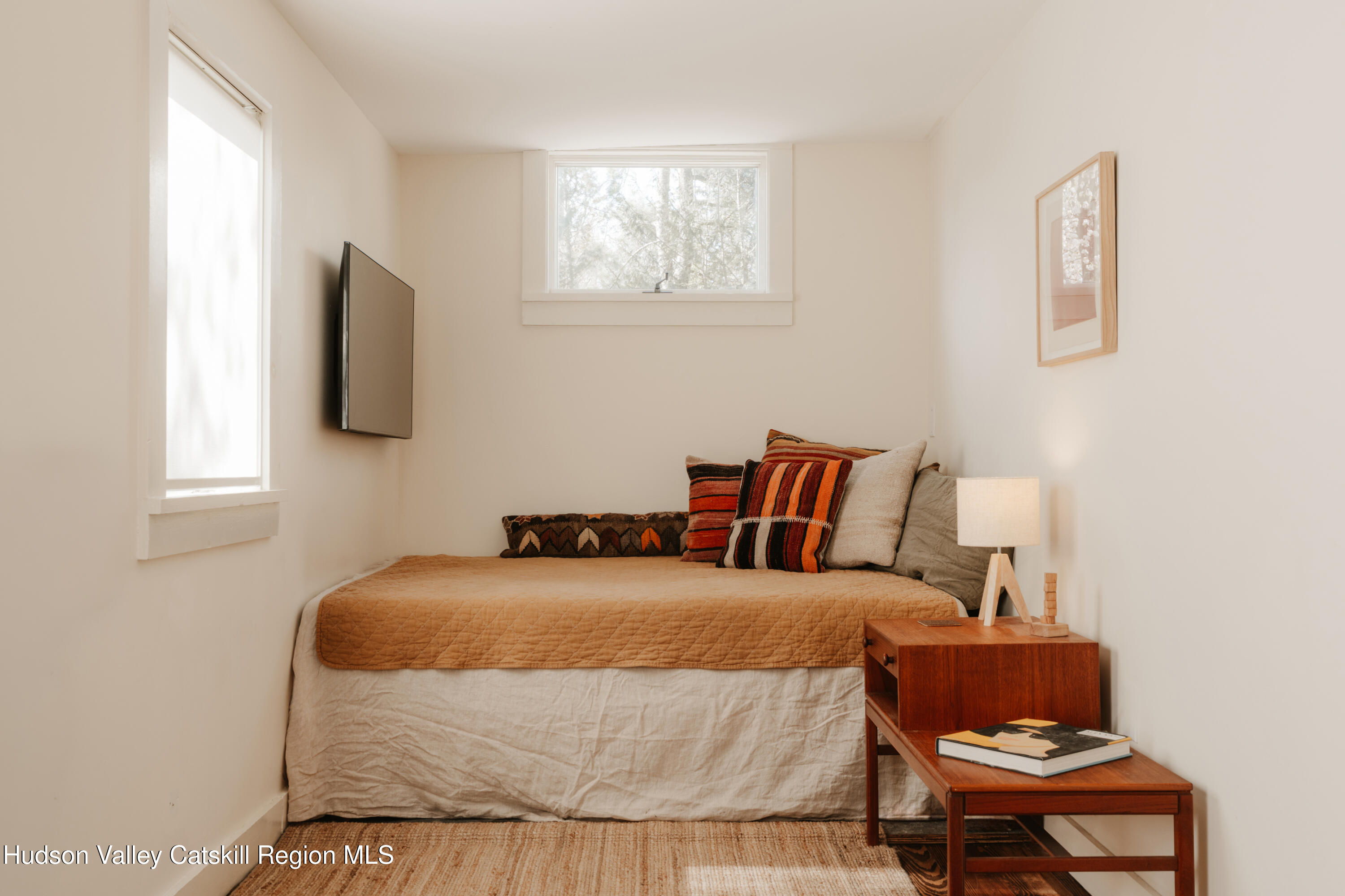 203 Reynolds Road Woodstock, NY 12498 - Photo 13 of 34 a bedroom with a bed and flat screen tv