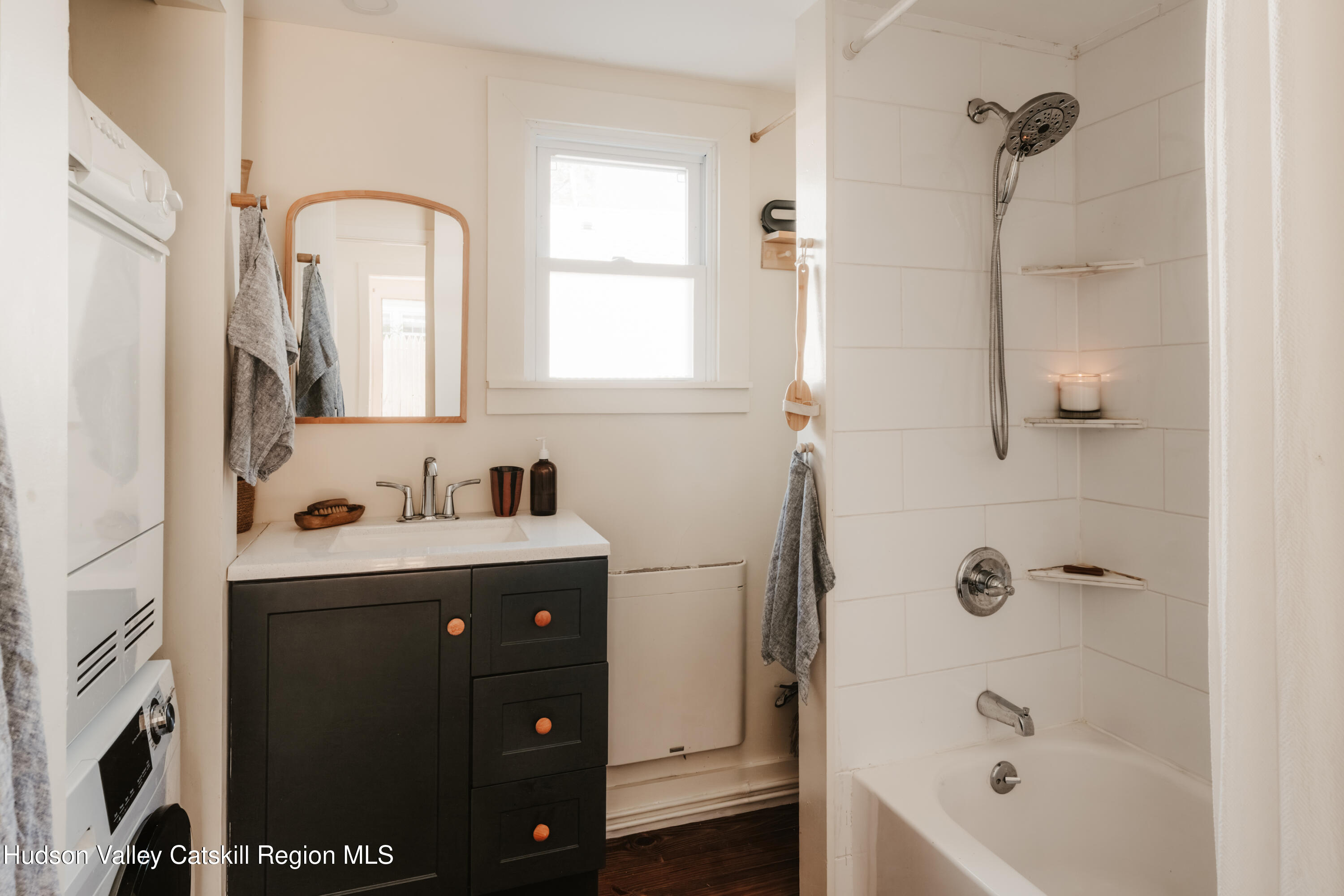 203 Reynolds Road Woodstock, NY 12498 - Photo 15 of 34 a bathroom with a bathtub sink and mirror