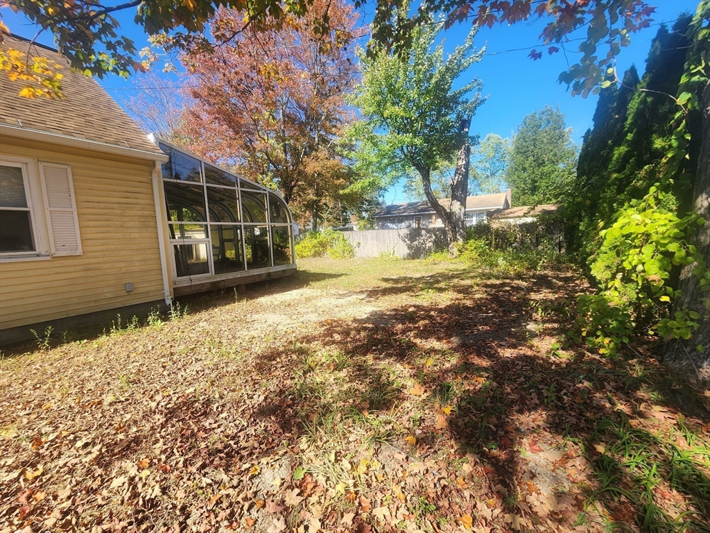2 Alice Street Montague, MA 01376 - Photo 4 of 18 a view of a yard with wooden fence and a tree