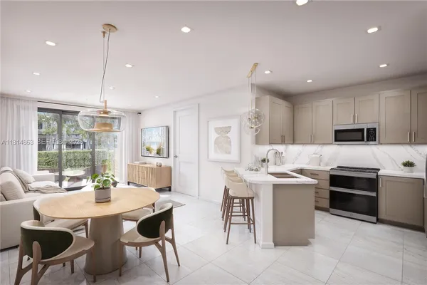 a kitchen that has a table and chairs in it