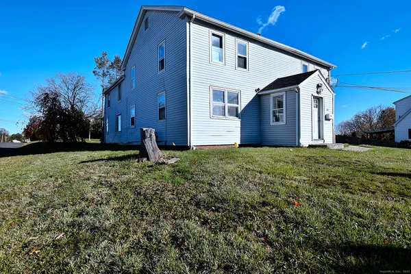 a front view of house with a yard
