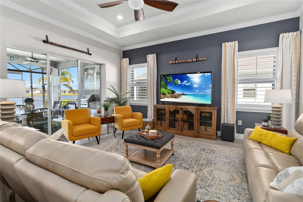 2744 Nature Vw Road St. Cloud, FL 34771 - Photo 16 of 49 a living room with fireplace furniture and a flat screen tv