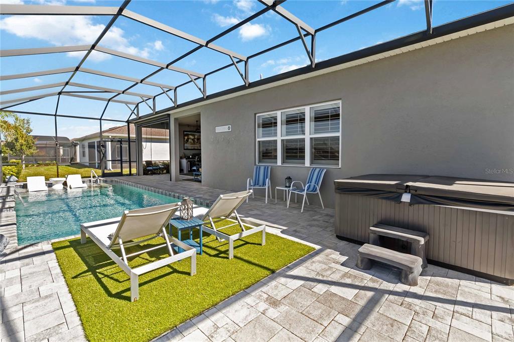 2744 Nature Vw Road St. Cloud, FL 34771 - Photo 23 of 49 a view of a patio with chairs and tables