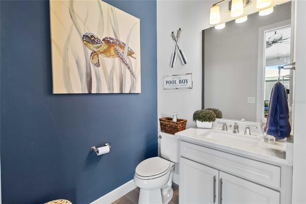 2744 Nature Vw Road St. Cloud, FL 34771 - Photo 26 of 49 a bathroom with a toilet sink and mirror