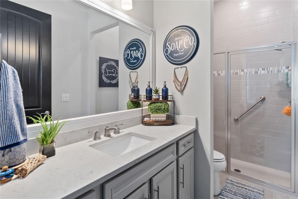 2744 Nature Vw Road St. Cloud, FL 34771 - Photo 29 of 49 a bathroom with a sink and a mirror