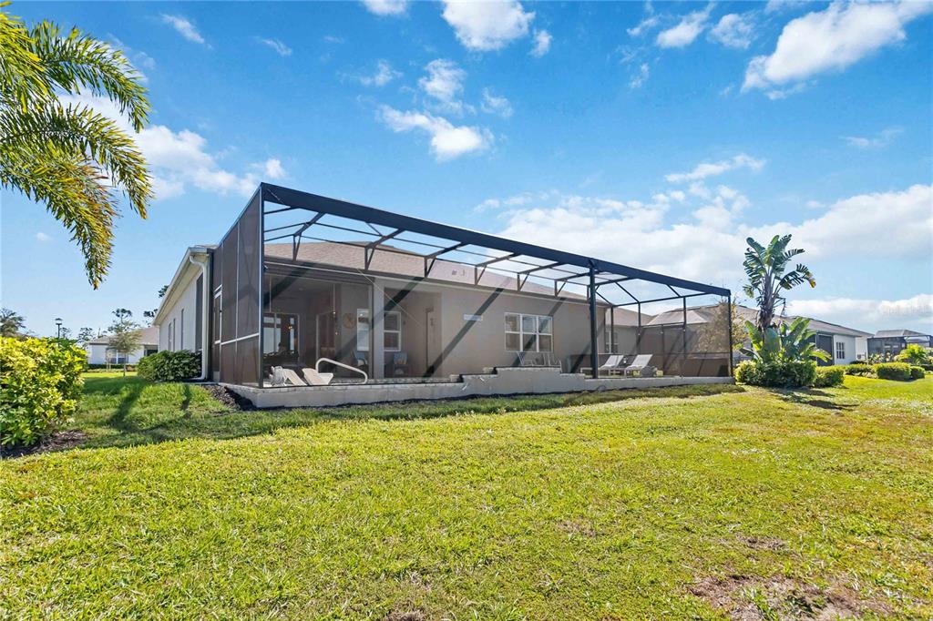 2744 Nature Vw Road St. Cloud, FL 34771 - Photo 39 of 49 a view of a house with swimming pool and sitting area