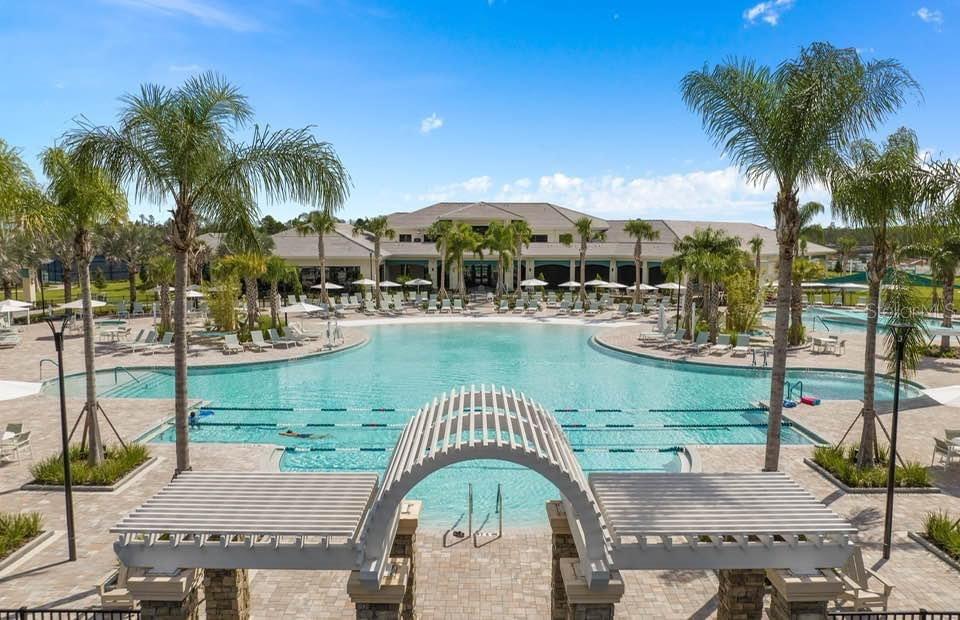 2744 Nature Vw Road St. Cloud, FL 34771 - Photo 46 of 49 a view of a lake with a table and chairs