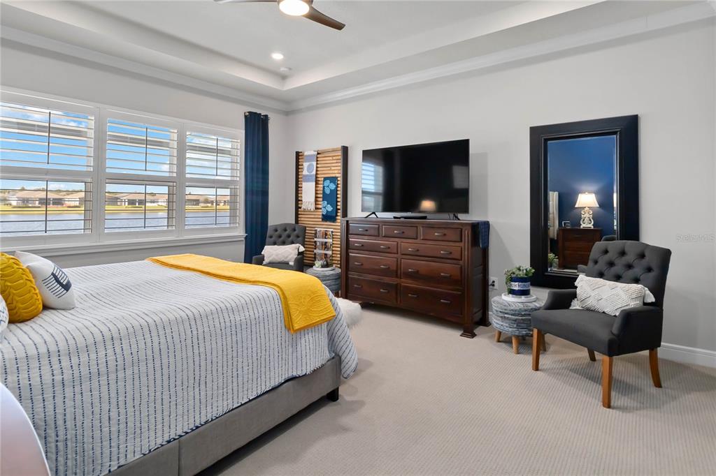 2744 Nature Vw Road St. Cloud, FL 34771 - Photo 10 of 49 a spacious bedroom with a bed and large windows