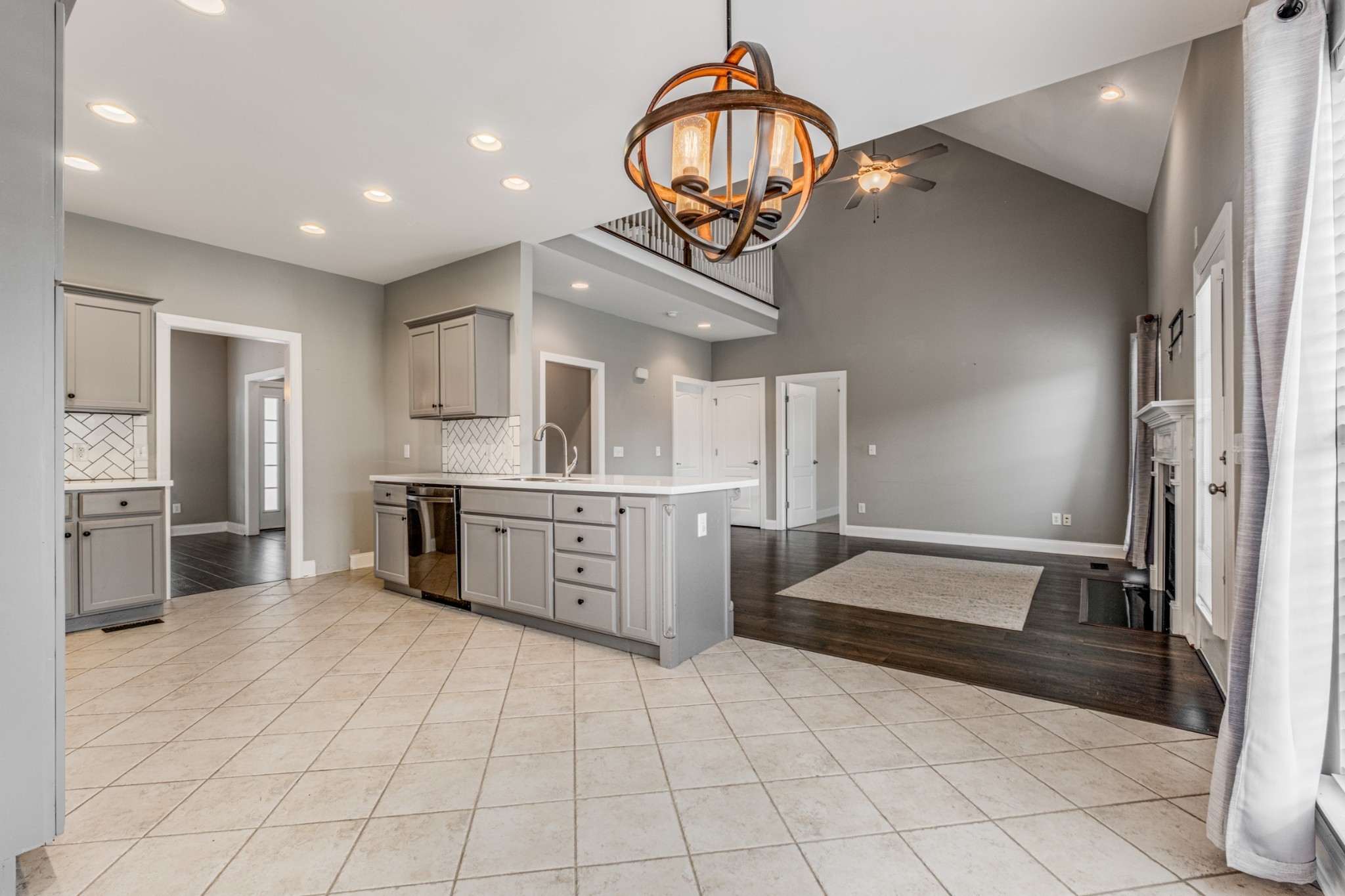 331 Midtown Trail Mount Juliet, TN 37122 - Photo 8 of 30 a large kitchen with stainless steel appliances a counter top space cabinets and a chandelier