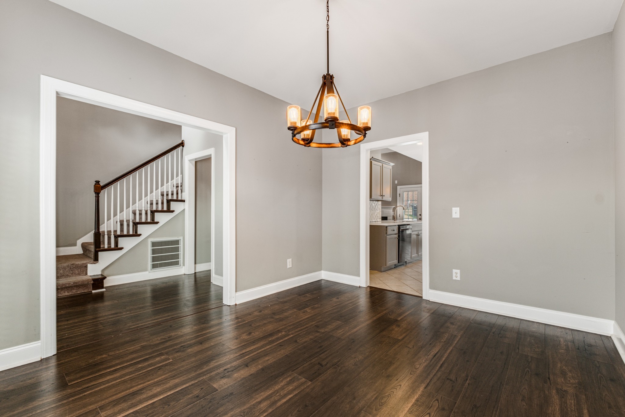 331 Midtown Trail Mount Juliet, TN 37122 - Photo 9 of 30 a view of a room with wooden floor staircase and a chandelier