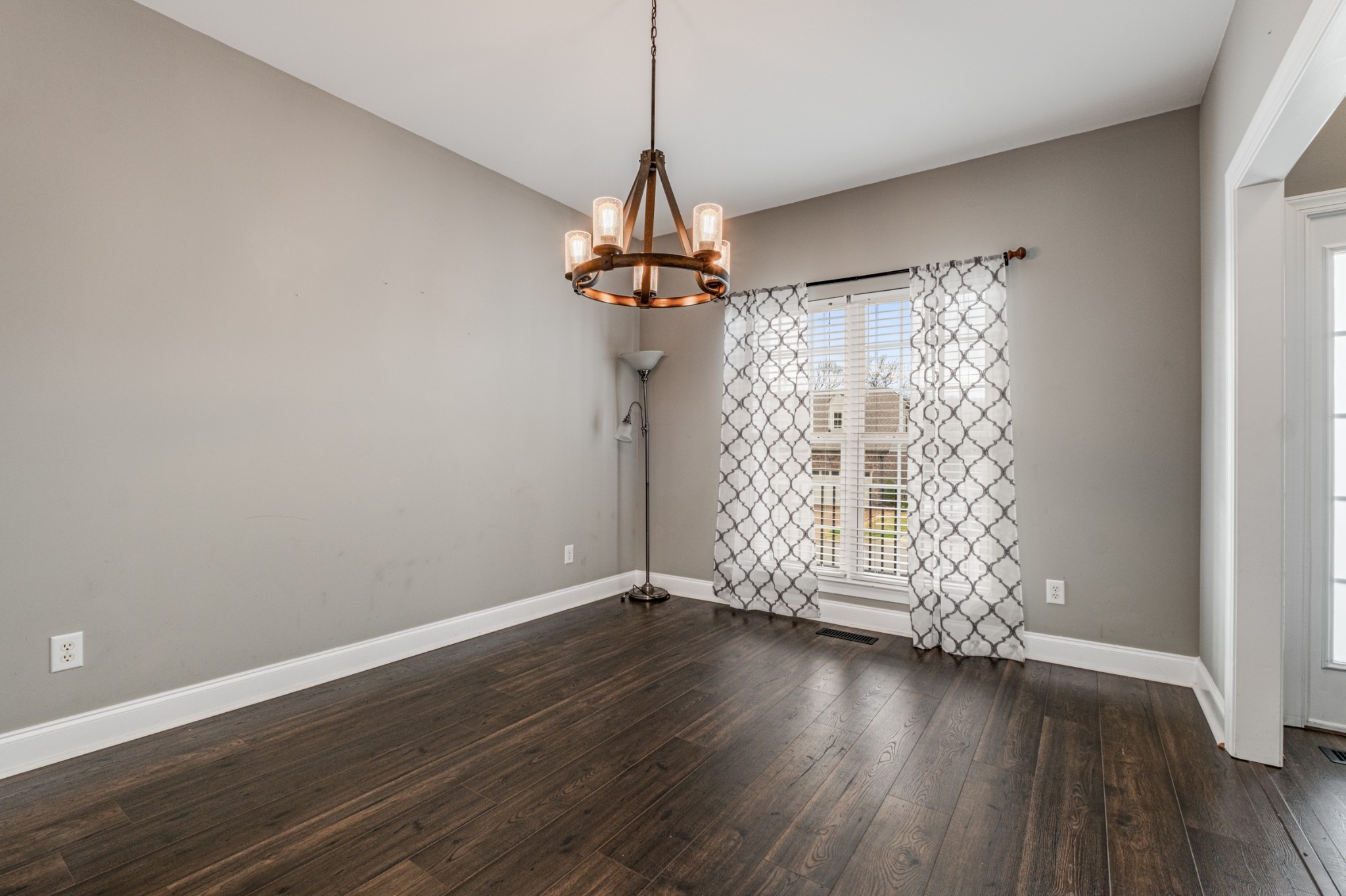 331 Midtown Trail Mount Juliet, TN 37122 - Photo 10 of 30 a view of a livingroom with wooden floor a ceiling fan and windows
