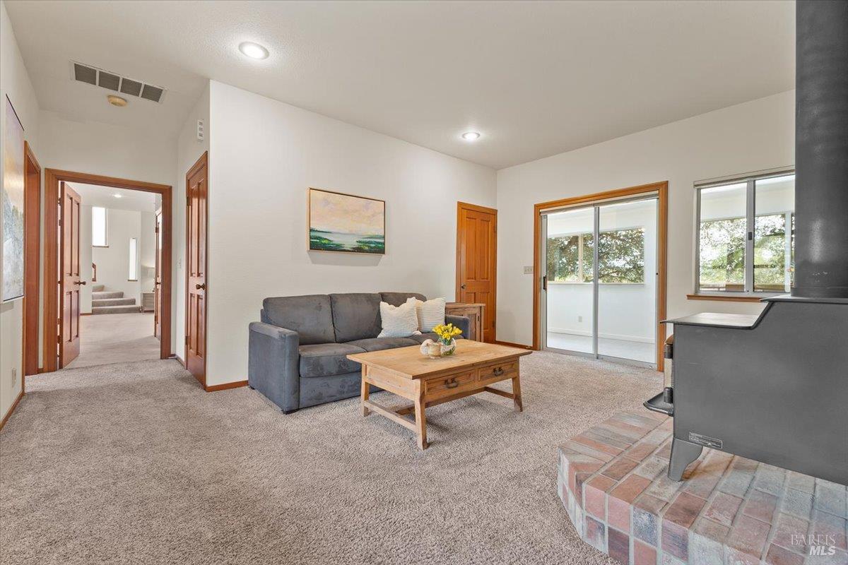 910-920 Lytton Springs Road Healdsburg, CA 95448 - Photo 15 of 59 a living room with furniture and large windows