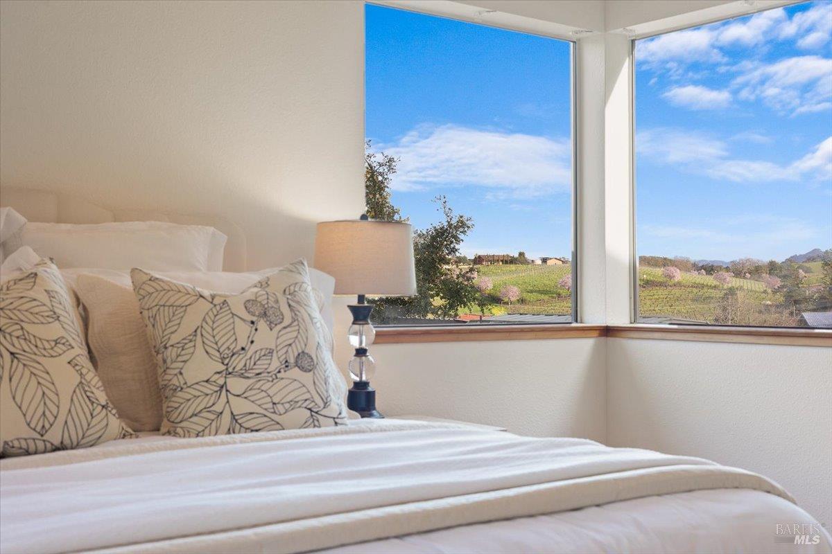 910-920 Lytton Springs Road Healdsburg, CA 95448 - Photo 17 of 59 a bedroom with a bed and window