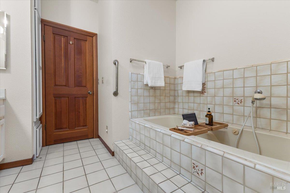 910-920 Lytton Springs Road Healdsburg, CA 95448 - Photo 22 of 59 a bathroom with a sink a toilet and shower