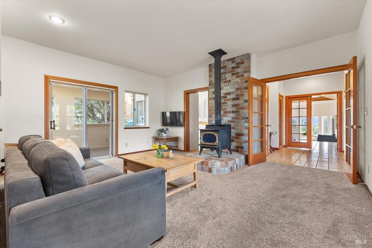 910-920 Lytton Springs Road Healdsburg, CA 95448 - Photo 24 of 59 a living room with furniture and large windows