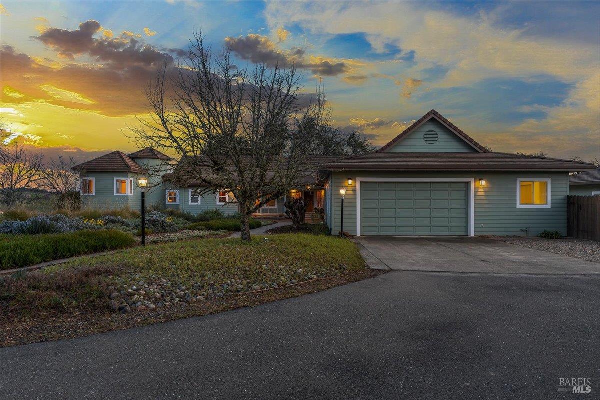 910-920 Lytton Springs Road Healdsburg, CA 95448 - Photo 56 of 59 a front view of a house with a yard and garage
