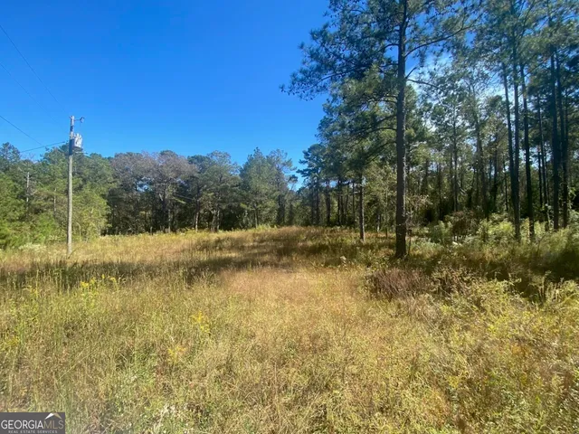 a view of lake with green space