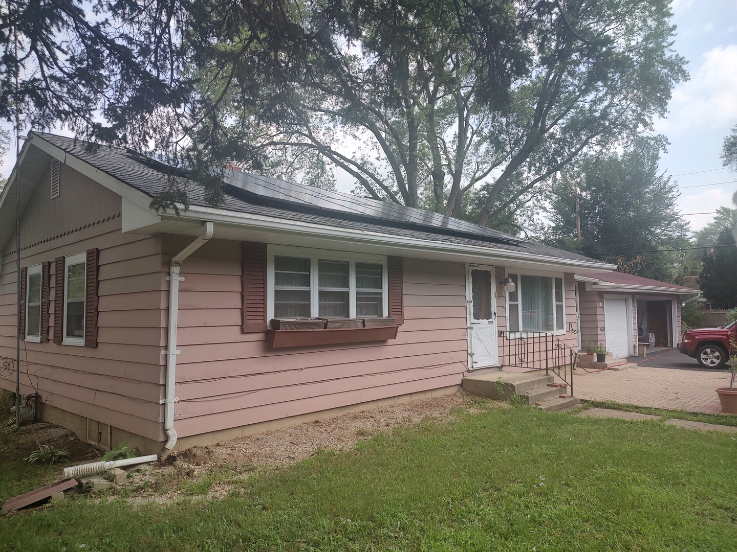 1045 Palace Street Aurora, IL 60506 - Photo 1 of 28 a backyard of a house with table and chairs