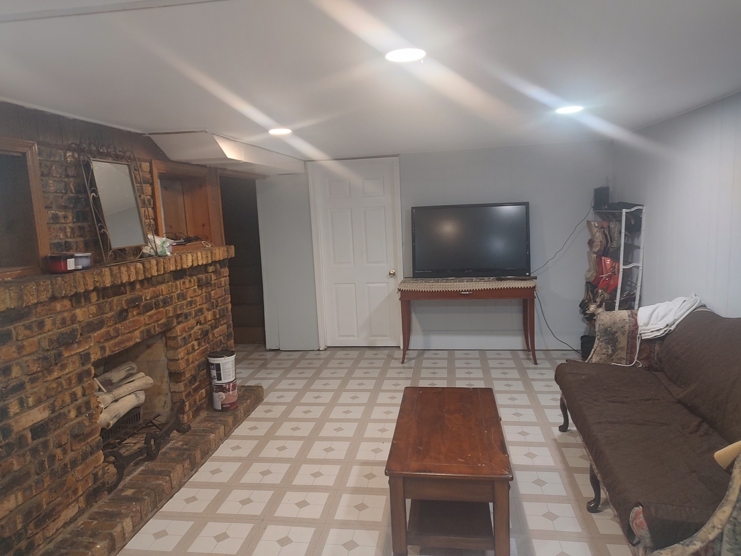 1045 Palace Street Aurora, IL 60506 - Photo 17 of 28 a living room with furniture and a flat screen tv