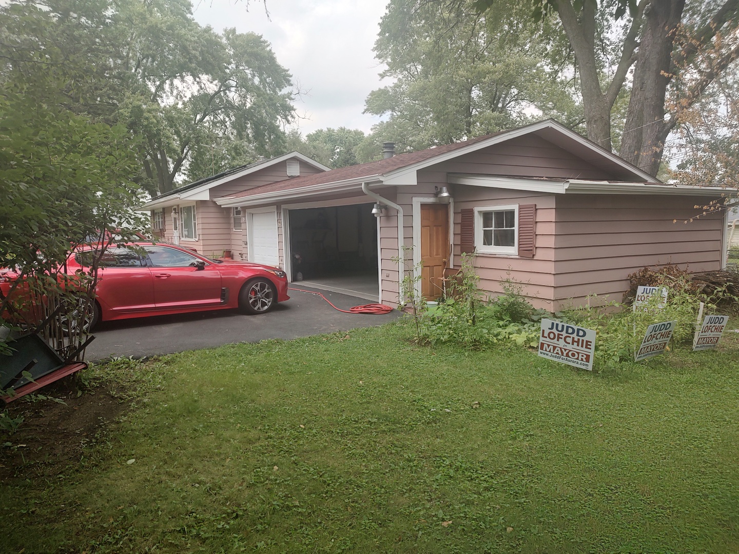 1045 Palace Street Aurora, IL 60506 - Photo 2 of 28 a front view of a house with a garden