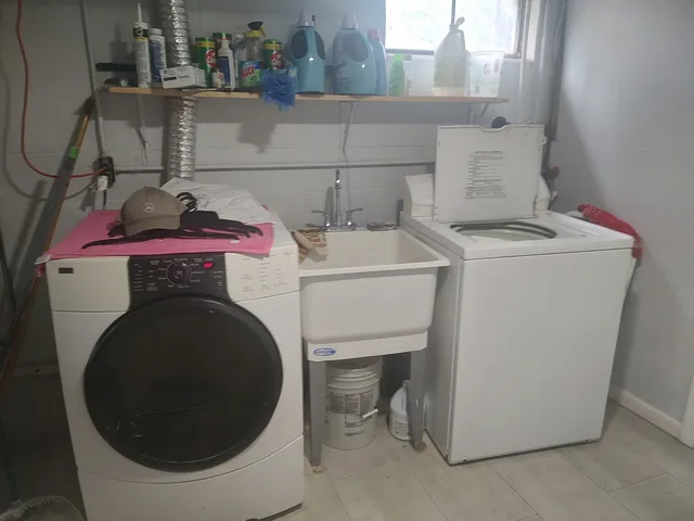 a utility room with dryer and washer