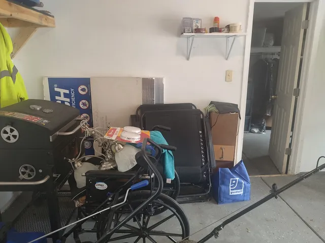 a living room with a bed and a table