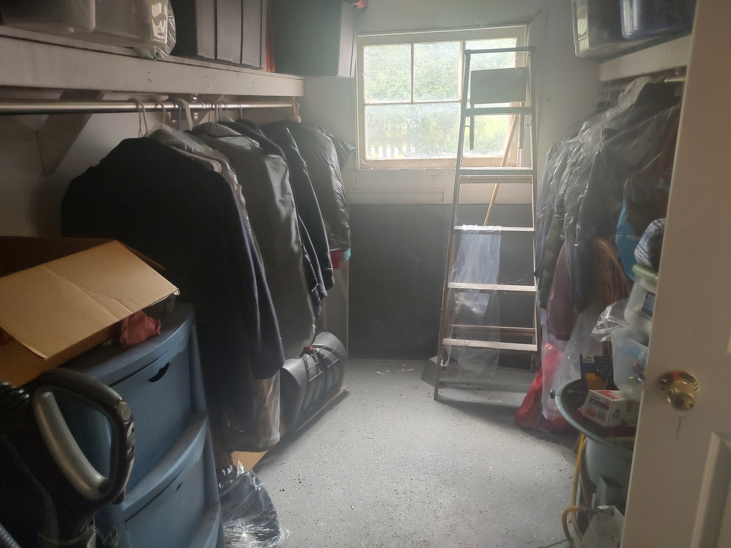 1045 Palace Street Aurora, IL 60506 - Photo 28 of 28 a view of walk in closet with clothes and shoes