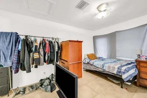 a bedroom with a bed and a closet