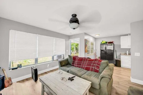 a living room with furniture and a window