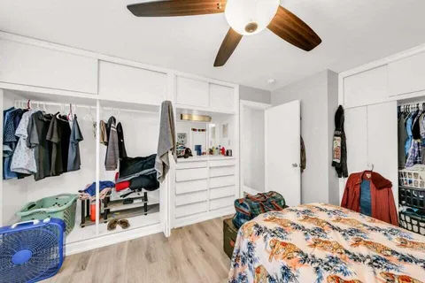 a bed room with a bed and a walk in closet