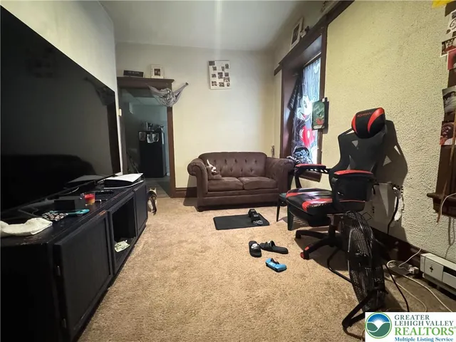 a bedroom with furniture and a window