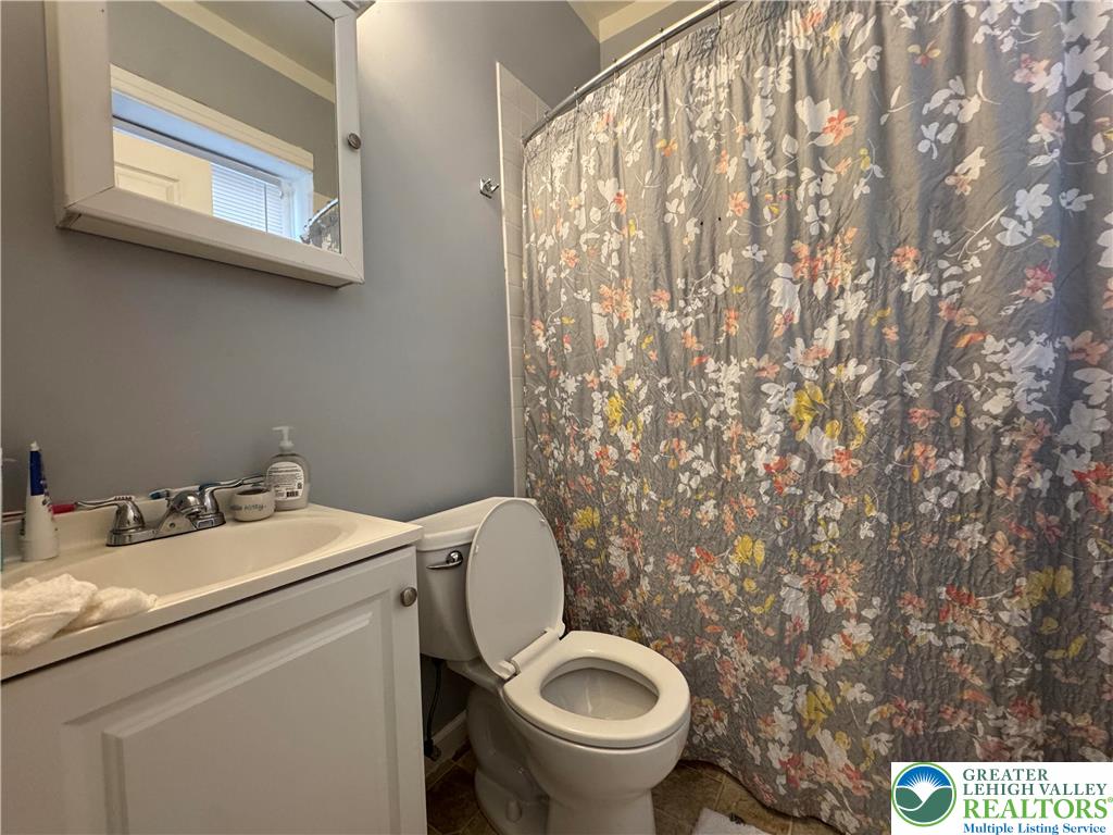 463 Montclair Avenue Bethlehem, PA 18015 - Photo 24 of 29 a bathroom with a granite countertop toilet and a sink