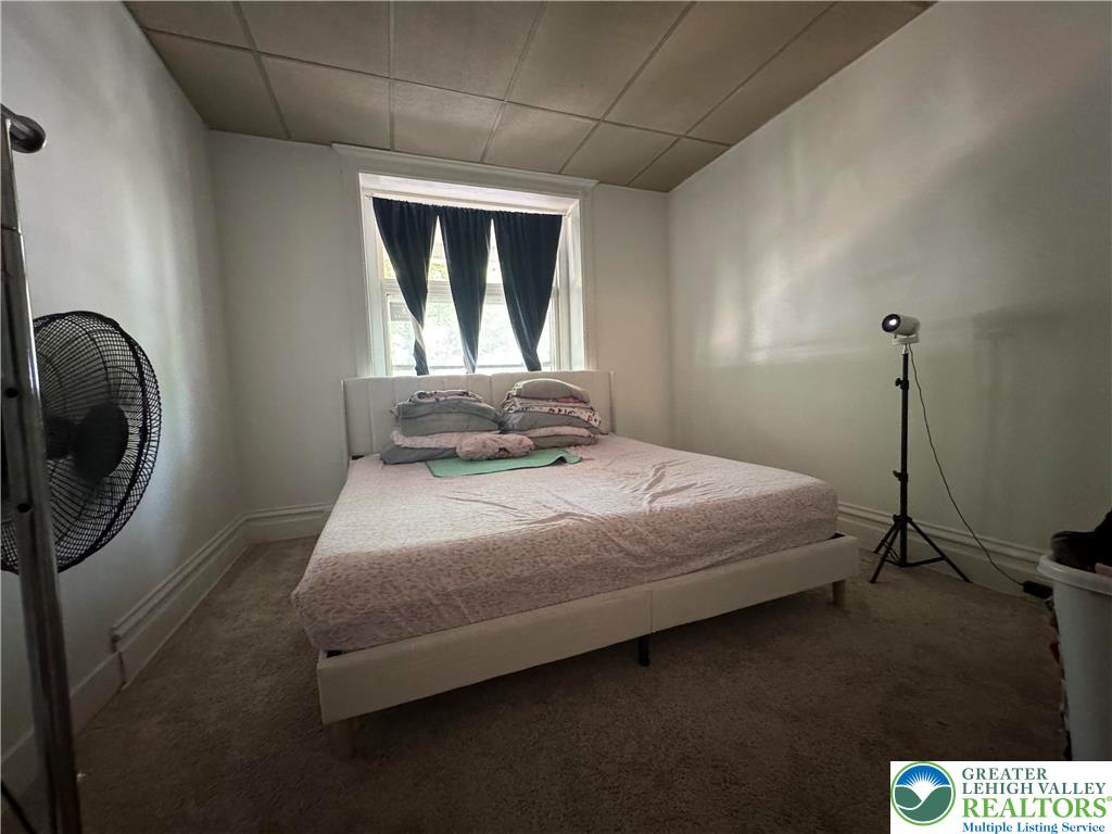 463 Montclair Avenue Bethlehem, PA 18015 - Photo 26 of 29 a bedroom with a bed and a mirror